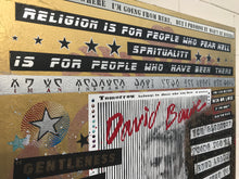 A close-up of a decorative wall Painting featuring religious and spiritual quotes, black-and-white text panels, stars, stripes, and a large red handwritten signature reading 'David Bowie' on a gold-toned background. This s my favorite quote of Bowie:
RELIGION IS FOR PEOPLE WHO FEAR HELL, SPIRITUALITY IS FOR PEOPLE WHO HAVE BEEN THERE.