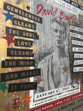 A close-up of a David Bowie poster or print featuring collage-style text, stars, stripes, and a black-and-white portrait. Visible text includes 'Gentleness Clears The Soul Love Cleans The Mind And Makes It Free,' 'January 8, 1947 to  infinite