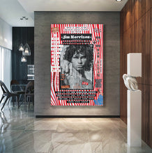 A large framed Jim Morrison poster displayed on a dark gray concrete wall in a modern dining room interior with wood paneling, marble floors, pendant lights, and a white sculptural side table.