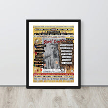 A framed art print featuring a stylized portrait of David Bowie surrounded by text and graphic elements, leaning against a white wall on a light wood floor.